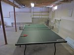 Ping pong game area in the unfinished basement